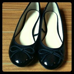 Shiny black ballet flats