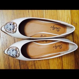 Studded lion head nude flats