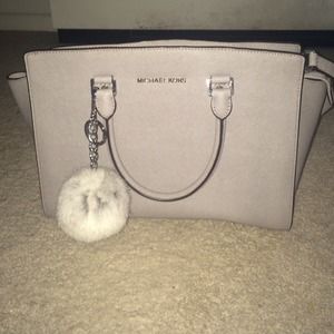 Gray Michael kors bag with pompon accessory