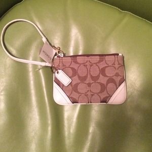 Tan and white Signature coach wristlet