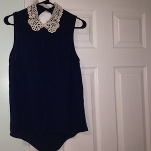 A navy blue sheer collared tank
