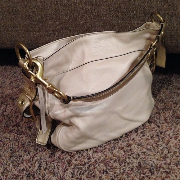 Cream and metallic gold Coach purse