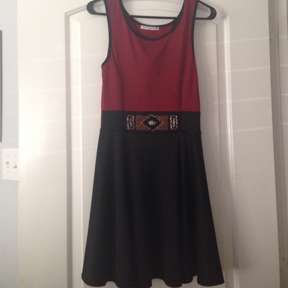 Maroon colored dress and the bottom is black