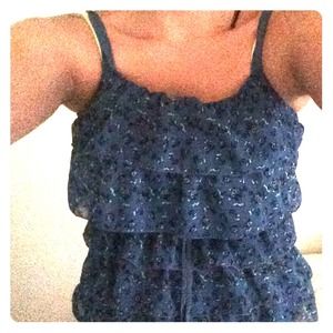 A frilly layerd shirt. Blue with floral.