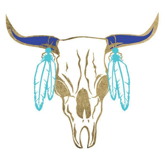 Metallic gold and turquoise tattoo of a cow skull