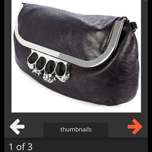 Snooki brass knuckle clutch.