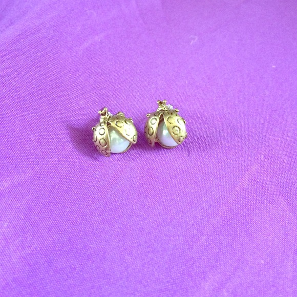 Gold ladybug earrings.