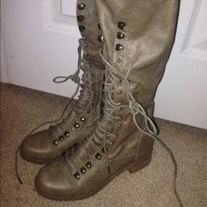 Knee high combat boots.