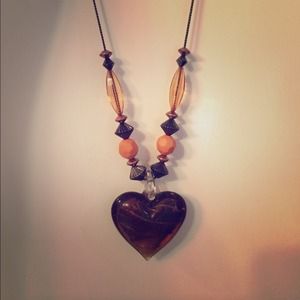 Brown beaded heart necklace.