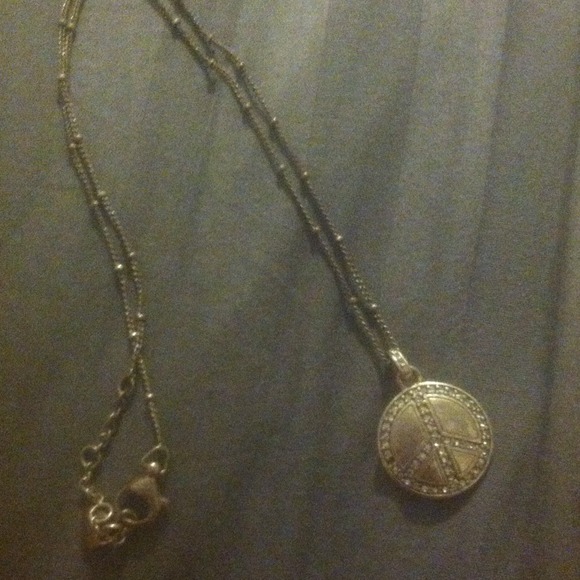 Fossil peace sign necklace