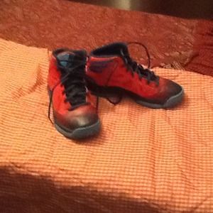 Boy Adidas tennis shoes.