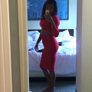 Red 2 piece matching crop shirt and skirt.