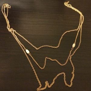 Gold played necklace with white stones