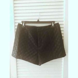 Black quilted pleather hot pants