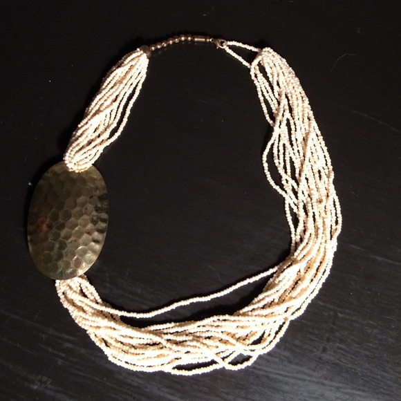 Gold Medallion with ivory beaded necklace