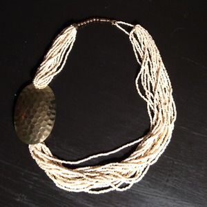 Gold Medallion with ivory beaded necklace