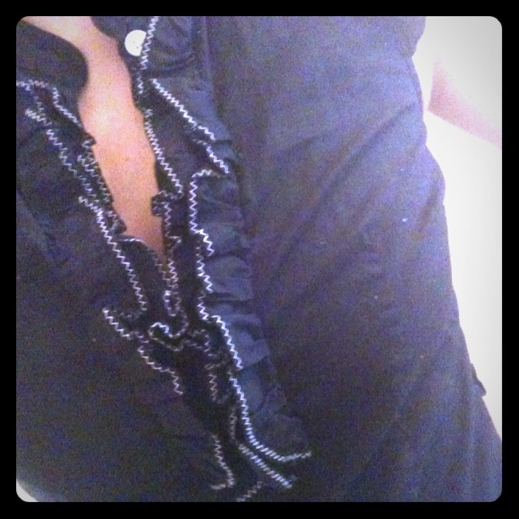 Black blouse with ruffles and white accents. - Picture 1 of 4