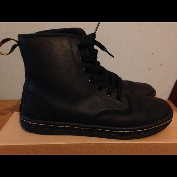 Dr. Martens black leather boots.