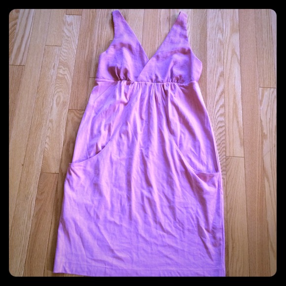 A casual dress with a low back & 2 front pockets.