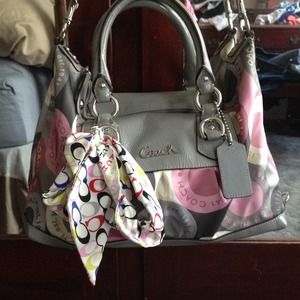 Medium sized pink and grey coach purse