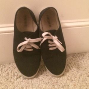 Stylish black sneakers.