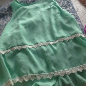 mint green sleeveless shirt