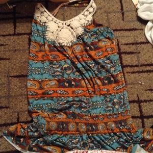 A dark floral print tank with lace at the neck