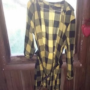 A black and yellow checkered shirt with belt