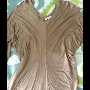 Tan drapey v-neck shirt.
