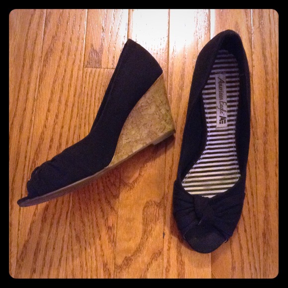 Cutesy black peep toe wedges with cork heel!