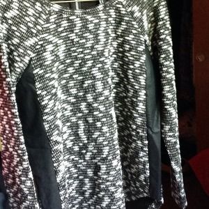 Leather paneled black and white sweater