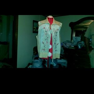 Beige sweater and leather vest