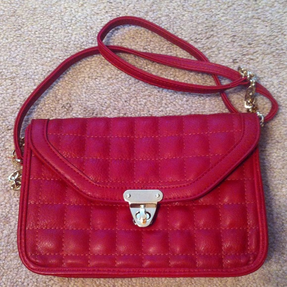 Burgundy quilted cross body bag.