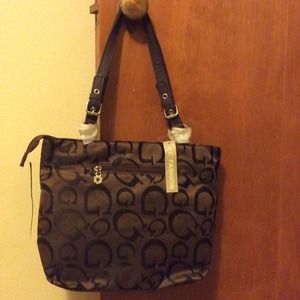 Brown purse with G symbols