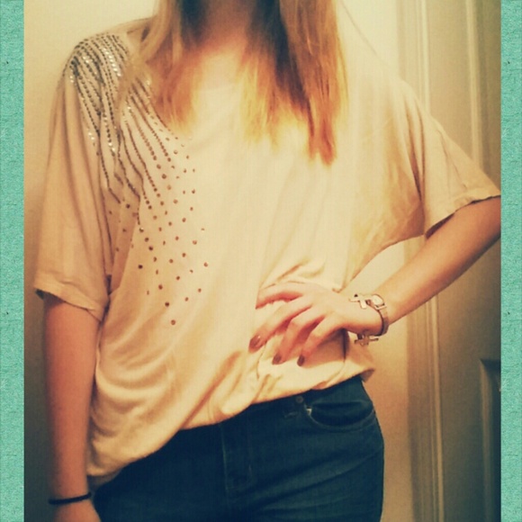 A lose creme blouse.