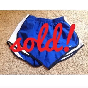 Blue and black Nike dri fit running shorts