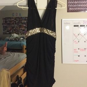 Black and gold sequined cocktail dress