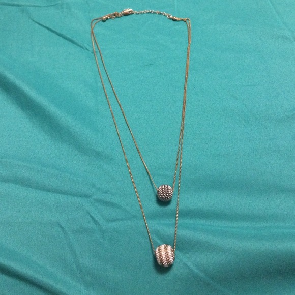 2 chains with ball pendants