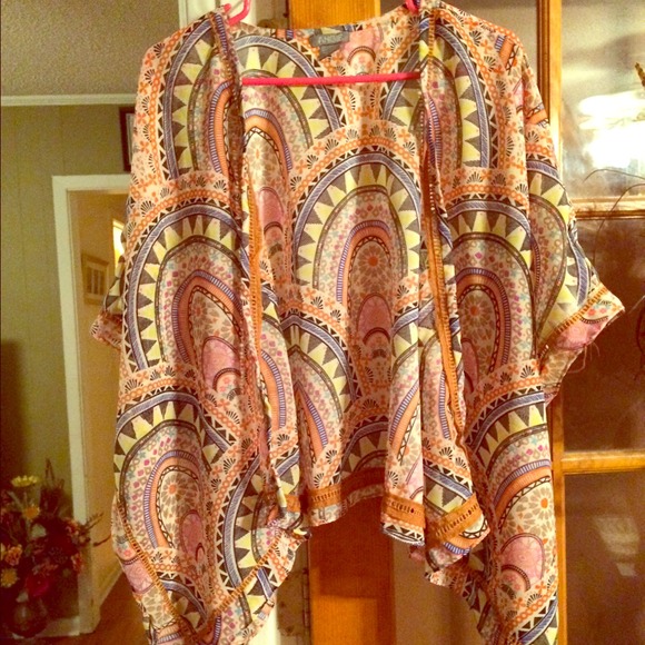 Cute sheer jacket/open shirt.