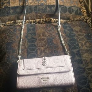 Pink guess brand purse.
