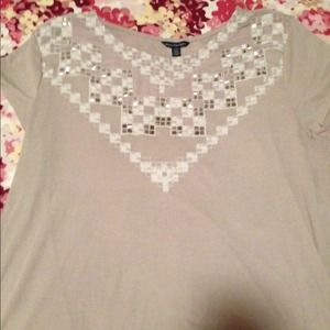 Beige shirt with beading