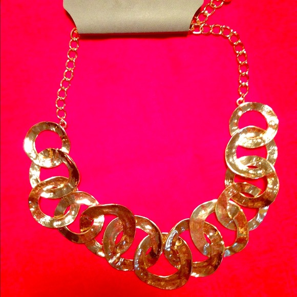 Gold statement necklace. With tags, never worn.