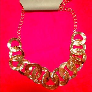 Gold statement necklace. With tags, never worn.