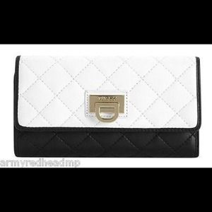 Brand new authentic DKNY black and white clutch