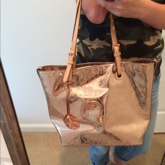 Metallic rose gold Michael Kors handbag