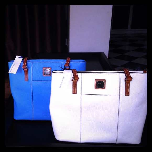 Two Dooney and Bourke bags still with tags New