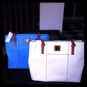 Two Dooney and Bourke bags still with tags New