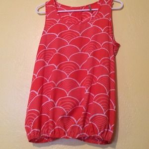 Pink blouse with design.