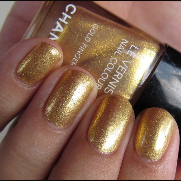 Gold fingers chanel nail polish. Used twice in box