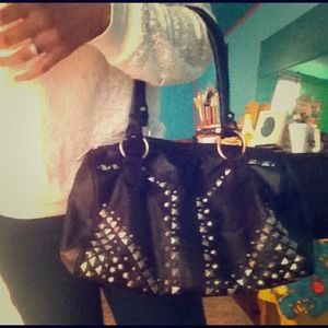 Black leather purse with gold studs